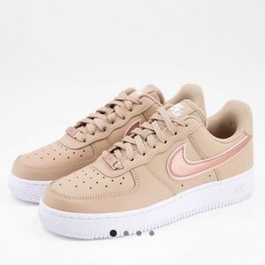 Nike Air Force 1 ‘07 ESS W sneakers in hemp/metallic rose  gold.